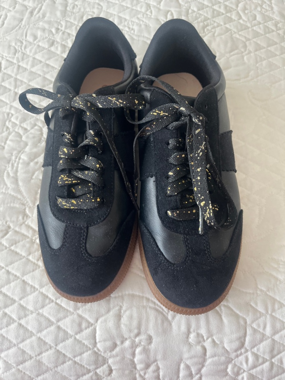 Macy’s On 34th black women’s sneakers.